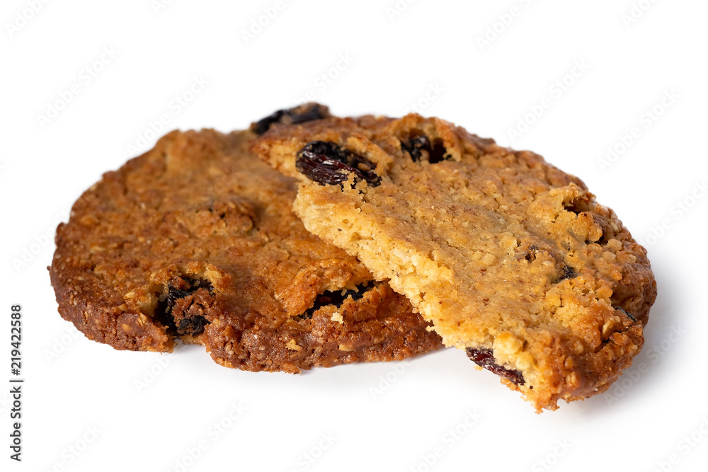 One and half oat and raisin round biscuits isolated on white. One and half oat and raisin round biscuits isolated on white.