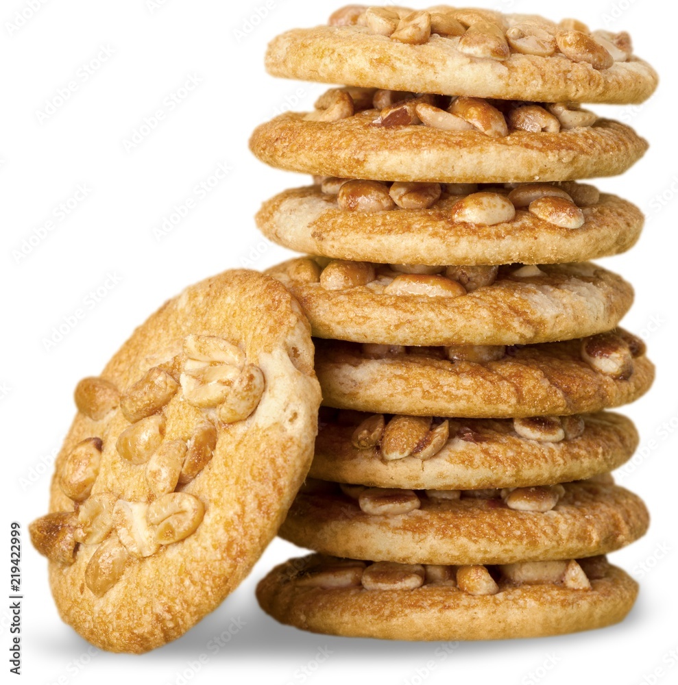 Delicious stacked cookies with nuts isolated on white background Delicious stacked cookies with nuts isolated on white background