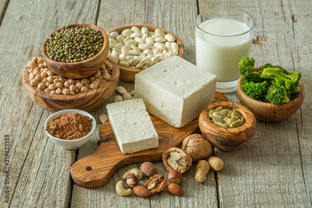 Selection vegan protein sources on wood background