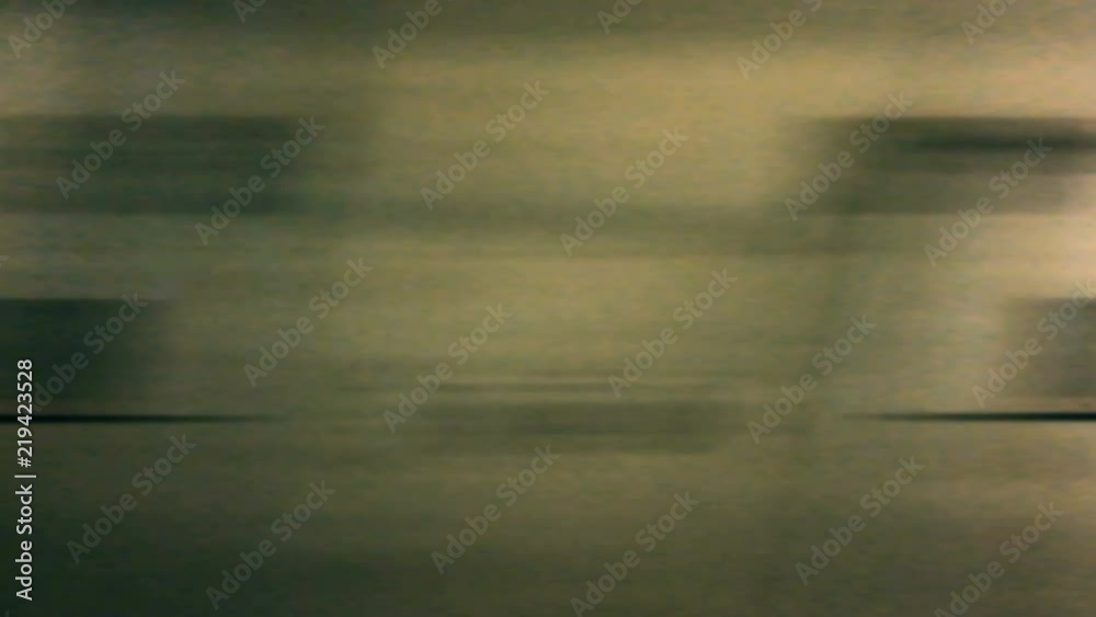 Uhd Footage :  Out side view of Underground train run through the tunnel . The tunnel wall and illuminate light