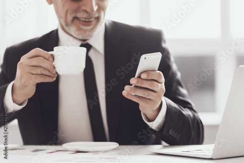 Smiling Adult Businessman on Coffee Break at Work