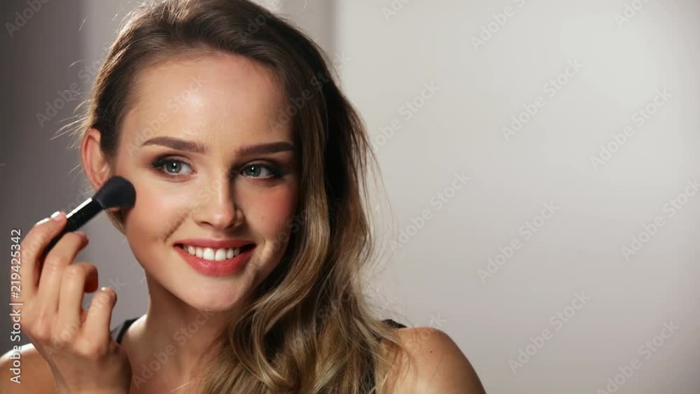 Woman With Beauty Face Applying Makeup Blush With Brush Woman With Beauty Face Applying Makeup Blush With Brush