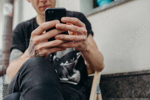 Close up of man using mobile smart phone.