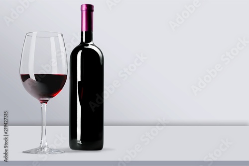 Red Wine in Bottle and Glass on white background