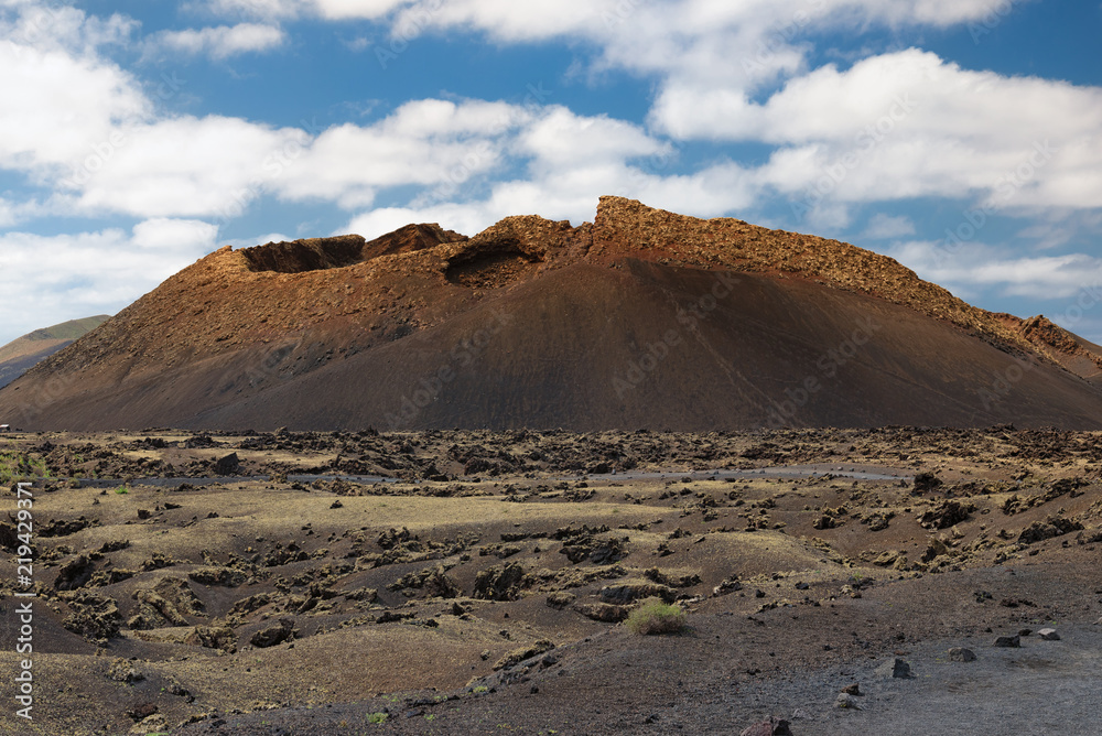 Volcano crater in Lanzarote, the Canary Islands, Spain, volcanic landscape, Timanfaya national park Volcano crater in Lanzarote, the Canary Islands, Spain, volcanic landscape, Timanfaya national park