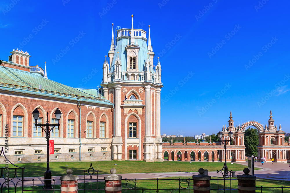 Architectural ensemble of buildings in Museum-reserve Tsaritsyno in Moscow on a blue sky background in sunny summer morning