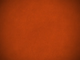 Texture cuir marron grainé vue de dessus à plat avec effet de vignetage sur la photo