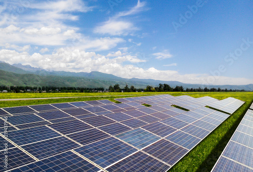 Huge solar panels generate electricity on vast grasslands