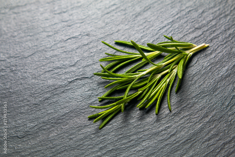 food herbal concept organic Rosemary on black slate stone board with copy space food herbal concept organic Rosemary on black slate stone board with copy space