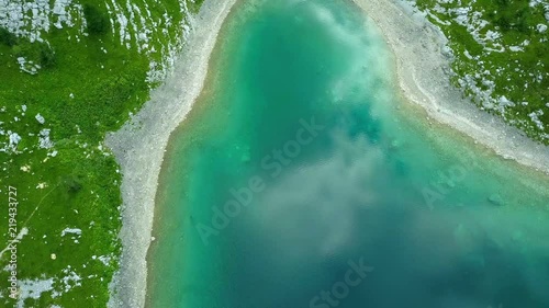 Aerial: Triglav national park in Slovenia, Seven lakes valley. Flying at Ledvica lake. Beautiful valley with lakes between high mountains.
