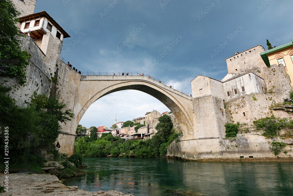 The Old Bridge in Mostar (Mostar's Old Bridge with dark and stormy sky in the background)