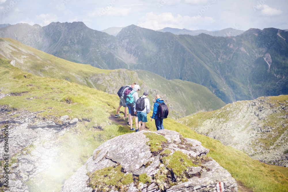 Friends meeting in Fagaras Mountains on a pathway
