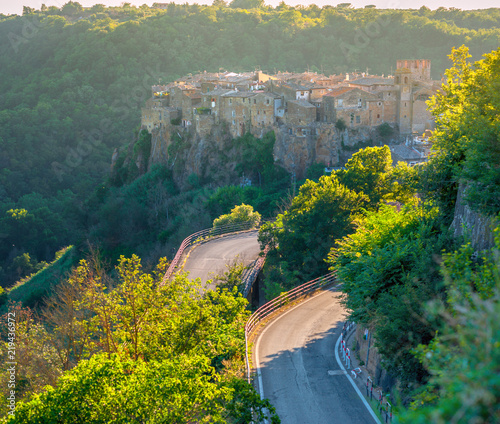Obraz na płótnie Beautiful medieval city at sunset and the route leading to it, Italy. Europe w salonie