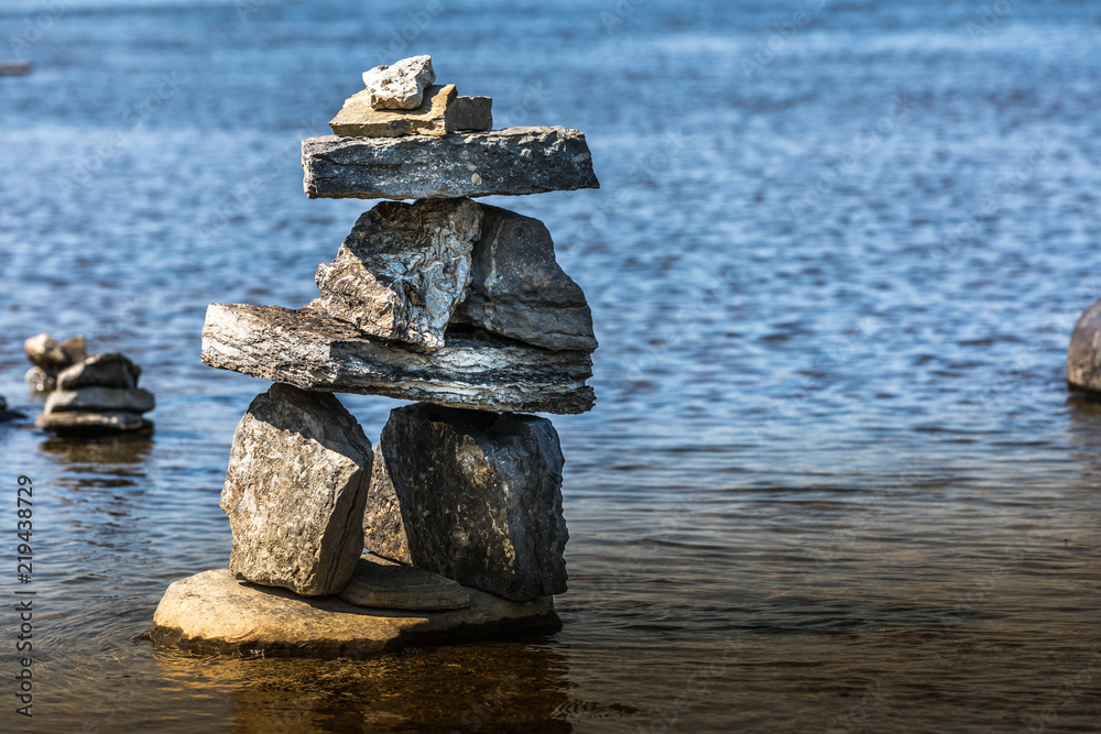 Inukshuk by the river edge.