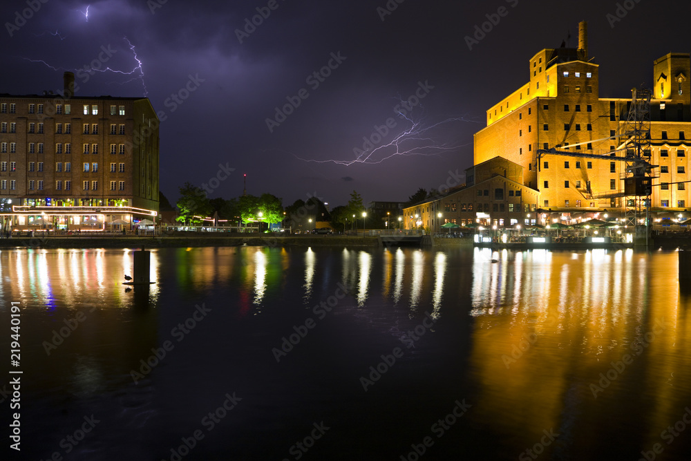 Obraz premium Harbor Buildings And Lightning