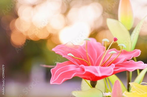 artificial flowers in beautiful small pot and beautiful bokeh background