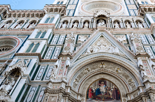 Detail of the carved decotations on the facade and portals of the famous basilica of Santa Maria del Fiore (Saint Mary of the flower), cathedral of Florence, Italy photo