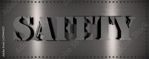 Brushed steel plate with rivets around it and the word 