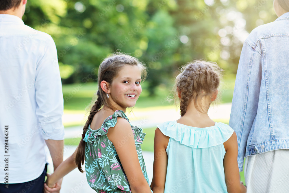 Obraz premium Young family with children having fun in nature
