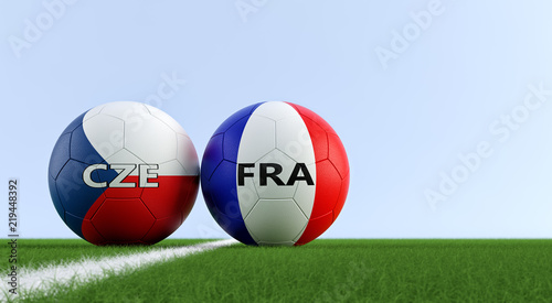 Czech Republic vs. France Soccer Match - Soccer balls in Czech Republic and France national colors on a soccer field. Copy space on the right side - 3D Rendering 