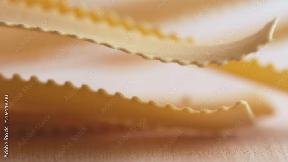 Throwing lasagna noodle on wooden surface. Shot with high speed camera, phantom flex 4K. Slow Motion. Throwing lasagna noodle on wooden surface. Shot with high speed camera, phantom flex 4K. Slow Motion.