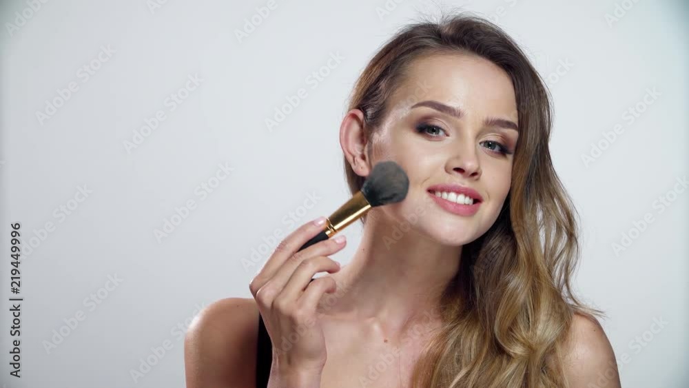 Woman With Beauty Makeup Using Facial Powder With Brush Woman With Beauty Makeup Using Facial Powder With Brush