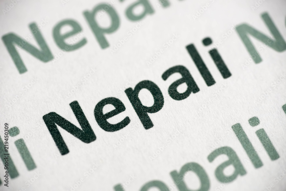 word Nepali language printed on paper macro