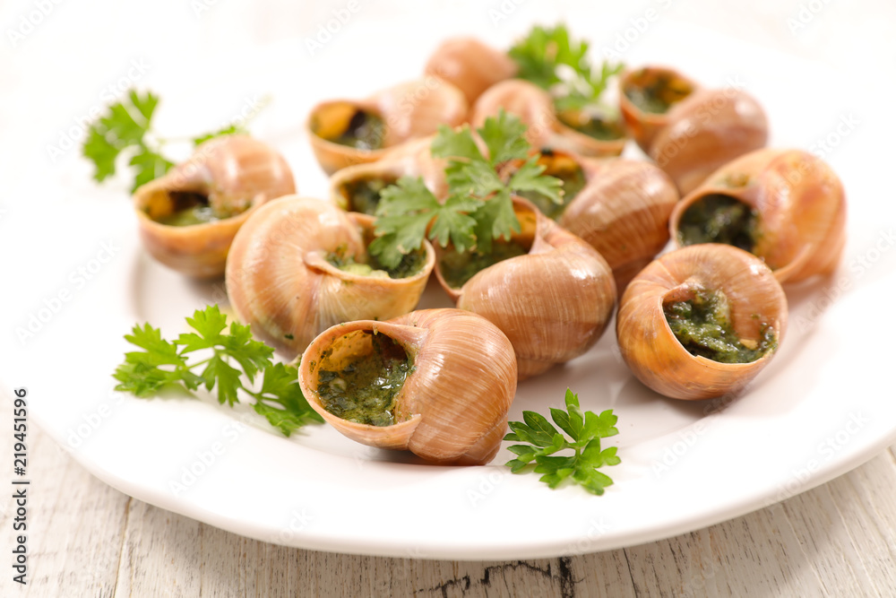 french dish, escargot with butter and parsley french dish, escargot with butter and parsley