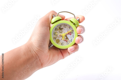 hand with alarm clock isolated against white background, time management concept.
