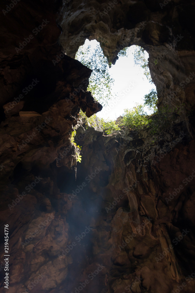 Light shinning through cave at Khaoluang, Phetchaburi Province in Thailand.