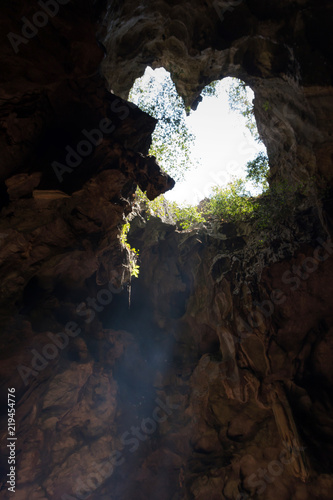 Light shinning through cave at Khaoluang, Phetchaburi Province in Thailand.