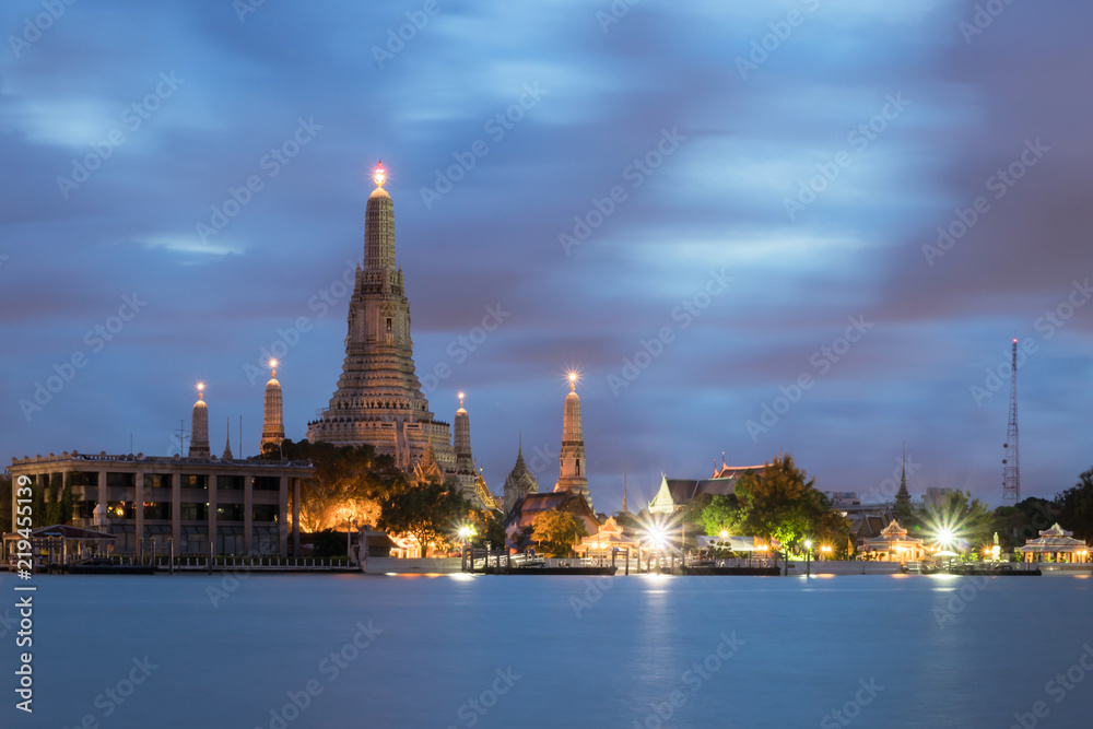 Wat Arun Ratchawararam Ratchawaramahawihan or Wat Arun (Temple of Dawn) is a Buddhist temple along the Chao Phraya river at twilight in Bangkok, Thailand. Long exposure