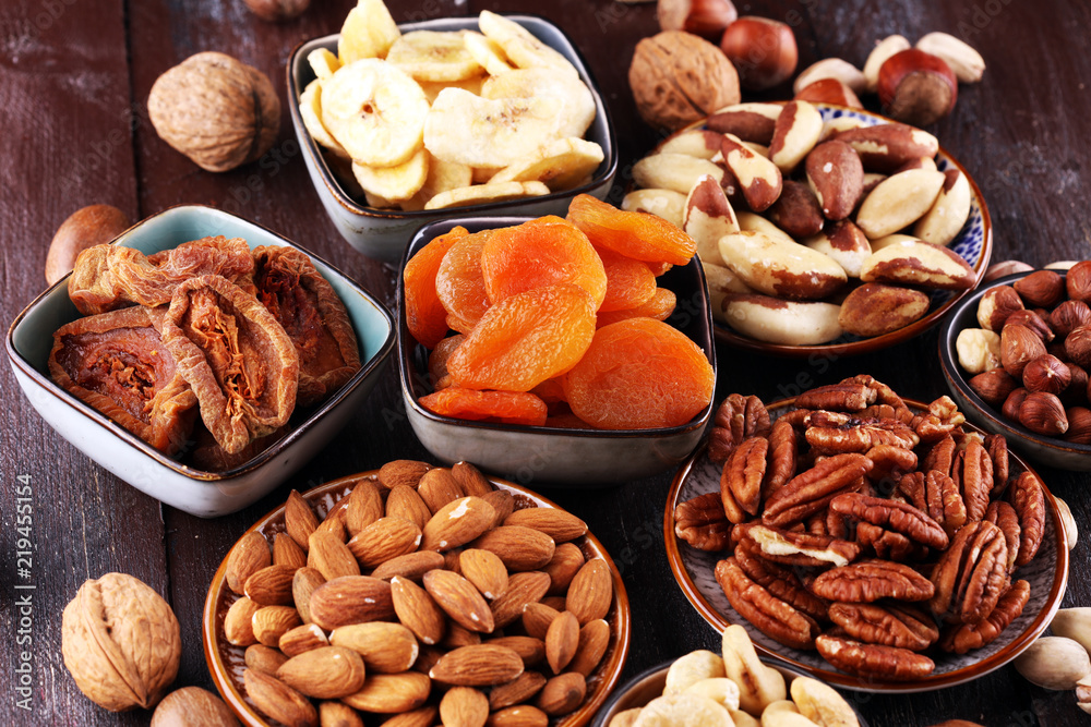 dried fruits and assorted nuts composition on rustic table dried fruits and assorted nuts composition on rustic table