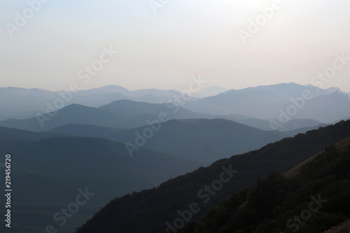 Silhouettes of misty mountains