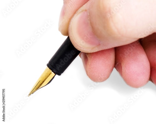 hand holding a pen writing