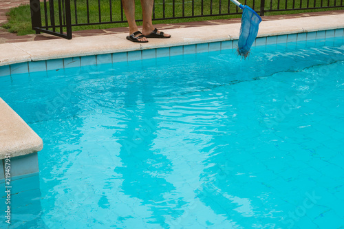 Man cleaning the pool