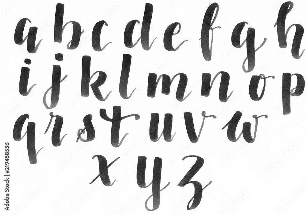 Hand lettering, modern calligraphy alphabet in black on a white paper,  handwritten with a personal font Stock Illustration
