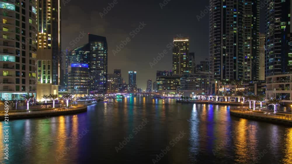 Dubai Marina and water canal night time lapse. pan up Dubai Marina and water canal night time lapse. pan up