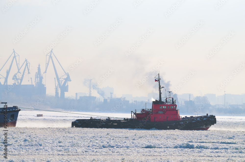 Towing a big tanker.