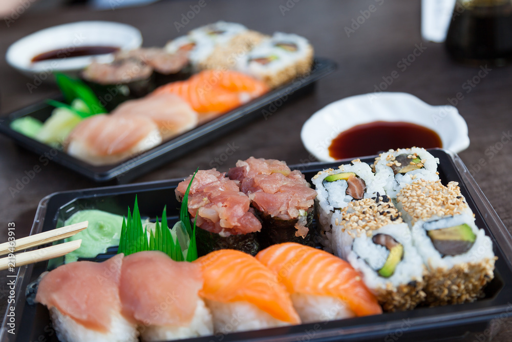 Different assortments of sushi rolls at outdoors restaurant Different assortments of sushi rolls at outdoors restaurant