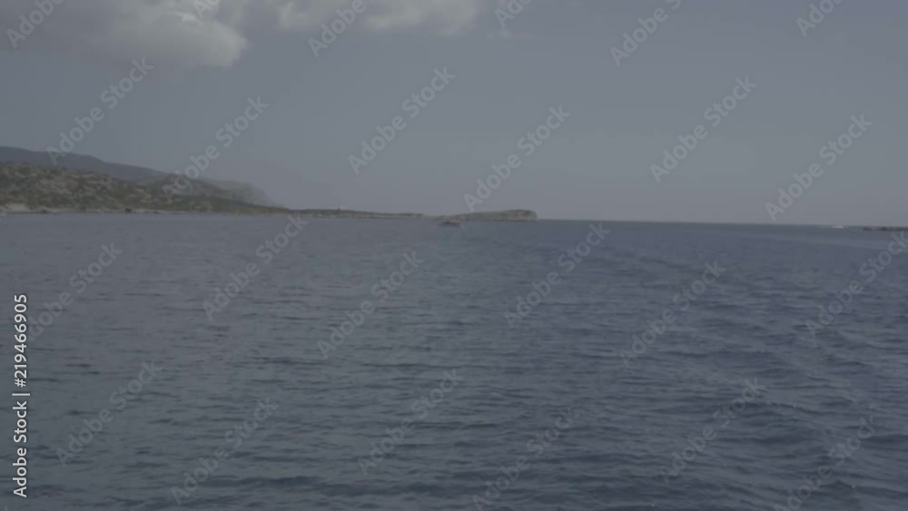Shimmering light across a bay of Greek islands Shimmering light across a bay of Greek islands