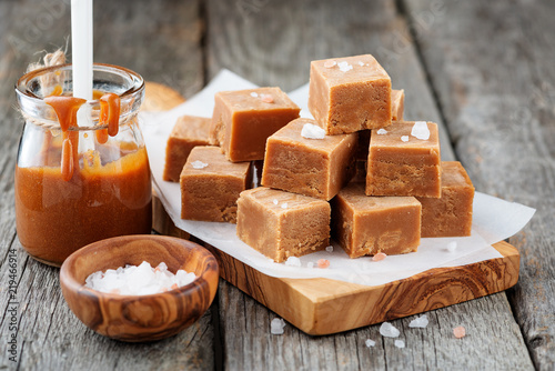 Salted caramel pieces and sea salt. Golden Butterscotch toffee caramels.  photo