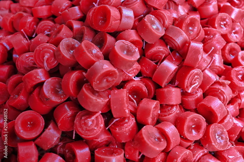 Obraz na plátne Pile of red candles stacked