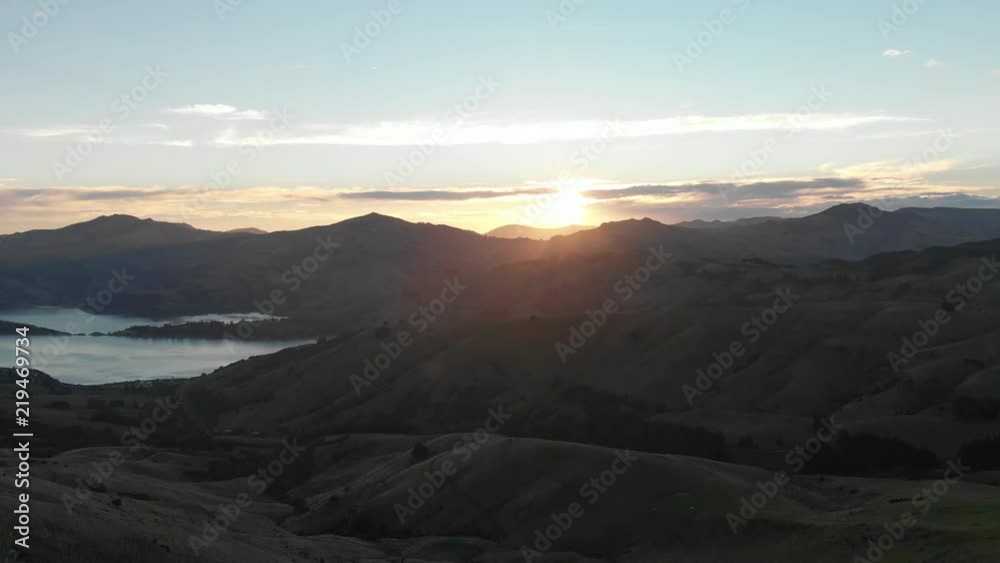 Wide aerial, sunset over mountain range Wide aerial, sunset over mountain range