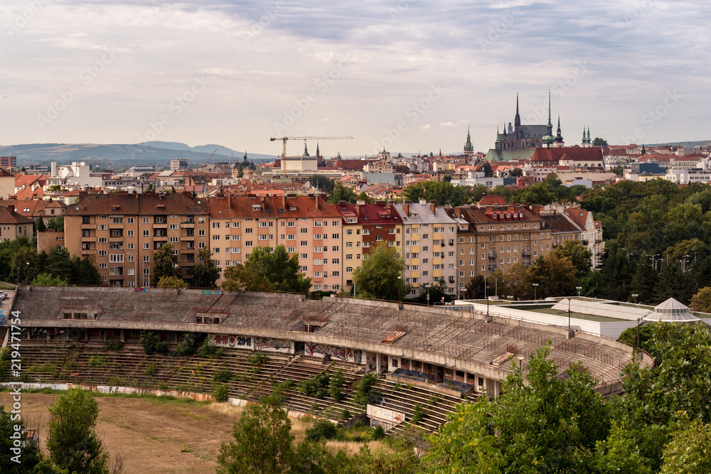 An old brownfield of former football arena contra renovated buildings in Brno, Czech Republic. Sadness of famous arena, where lots of mathes were played but modernisation brings that arena to oblivion