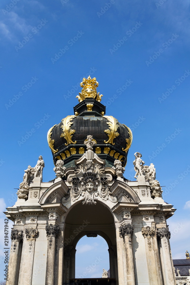 Meeting point Kronentor, crown gate detail at baroque Zwinger palace in Dresden, Germany, sunny day blue sky background