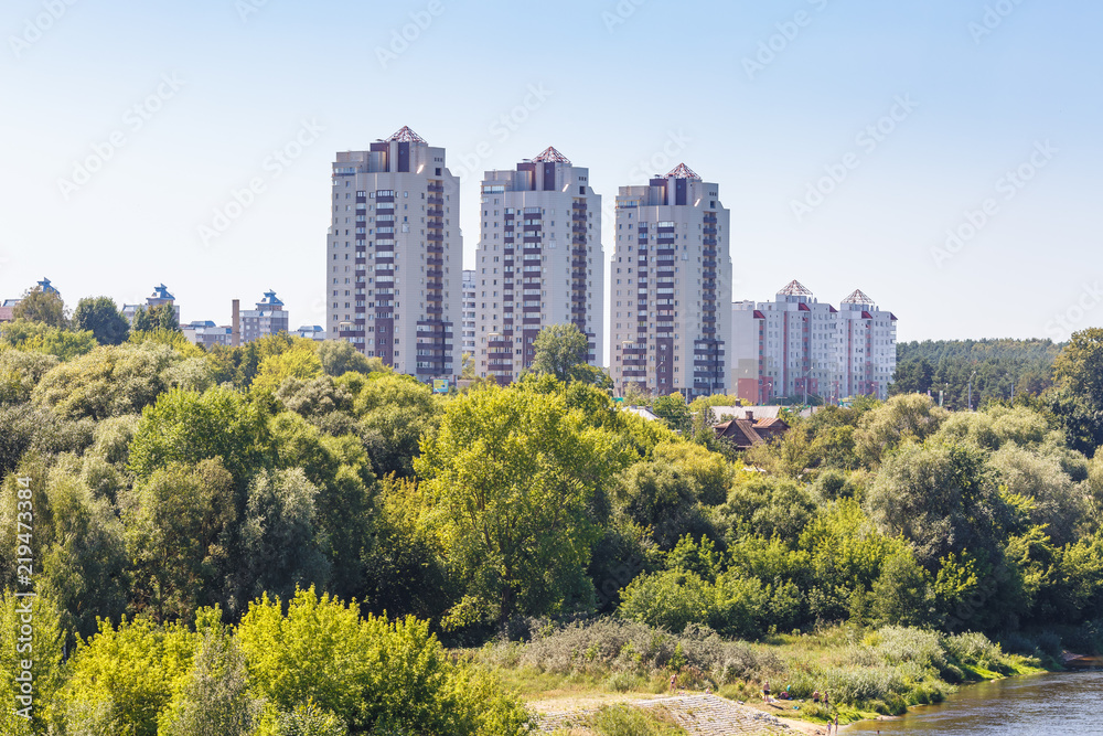 high-rise apartment buildings in the middle of the forest
