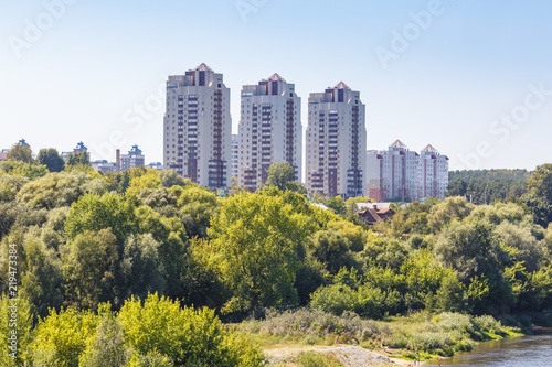 high-rise apartment buildings in the middle of the forest