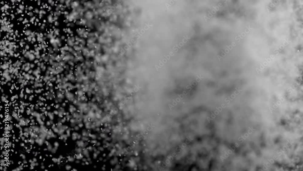 Camera follows throwing kosher salt into water. Overhead shot. Shot with high speed camera, phantom flex 4K. Slow Motion.