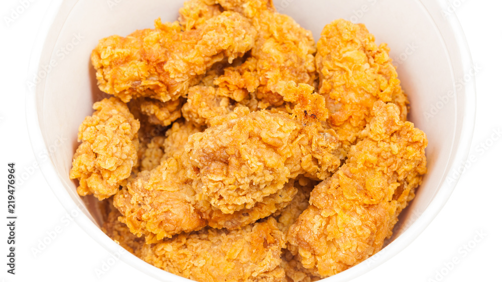 many crispy deep-fried chicken wings in bucket many crispy deep-fried chicken wings in bucket